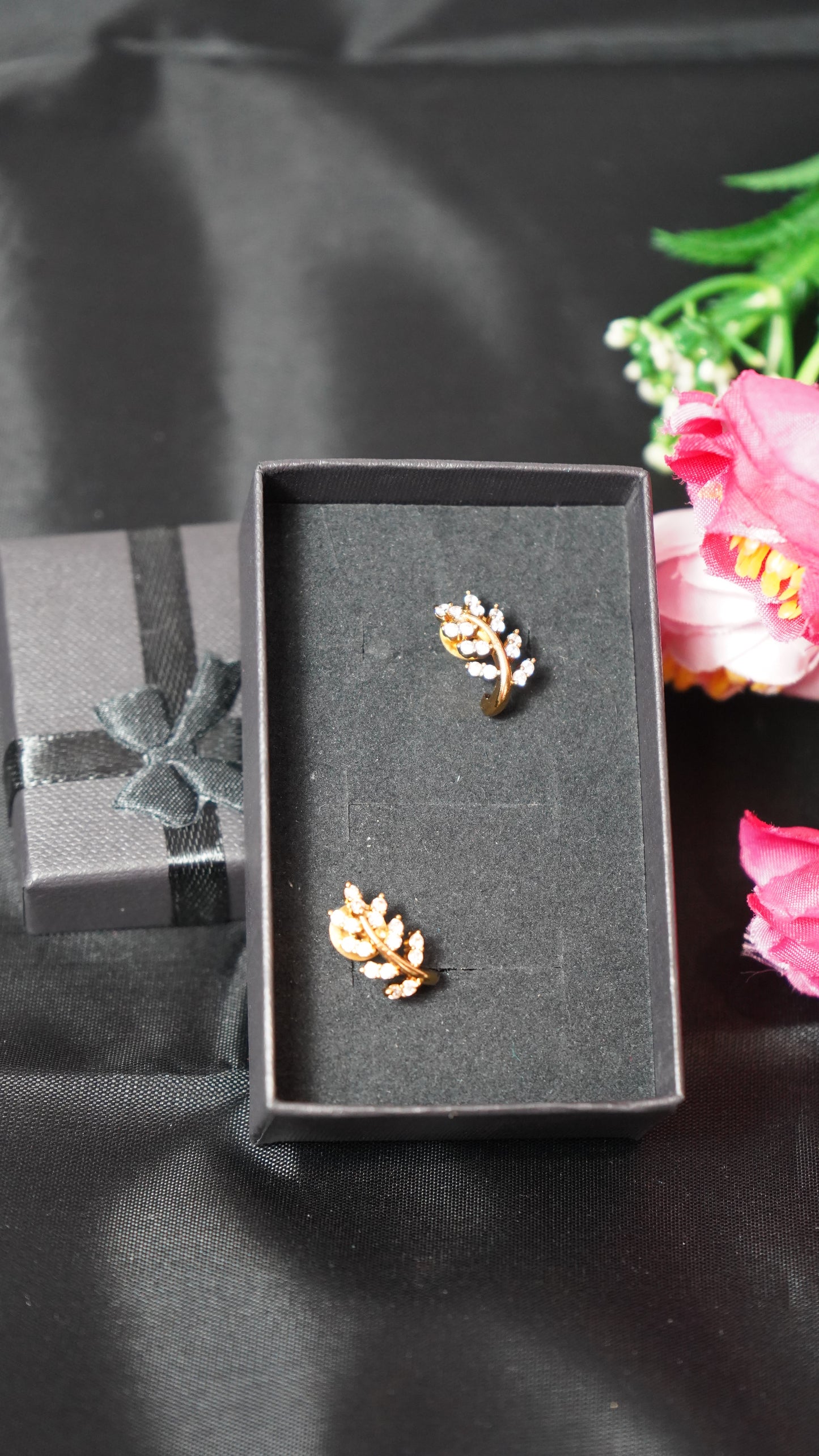 Small Stud Earrings with a leaf detailed in gold finish