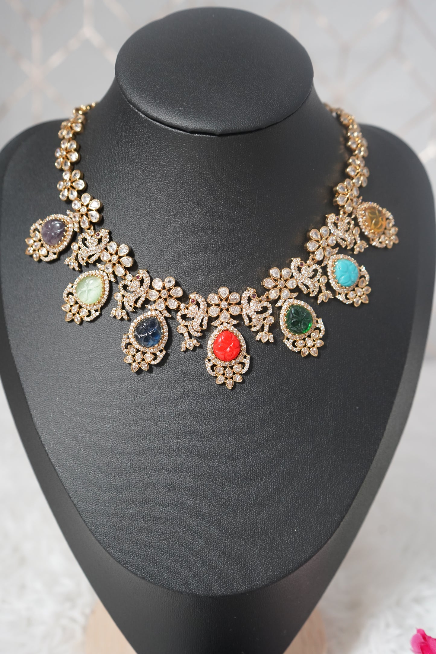 A vibrant Navratna necklace set crafted with Victorian polish