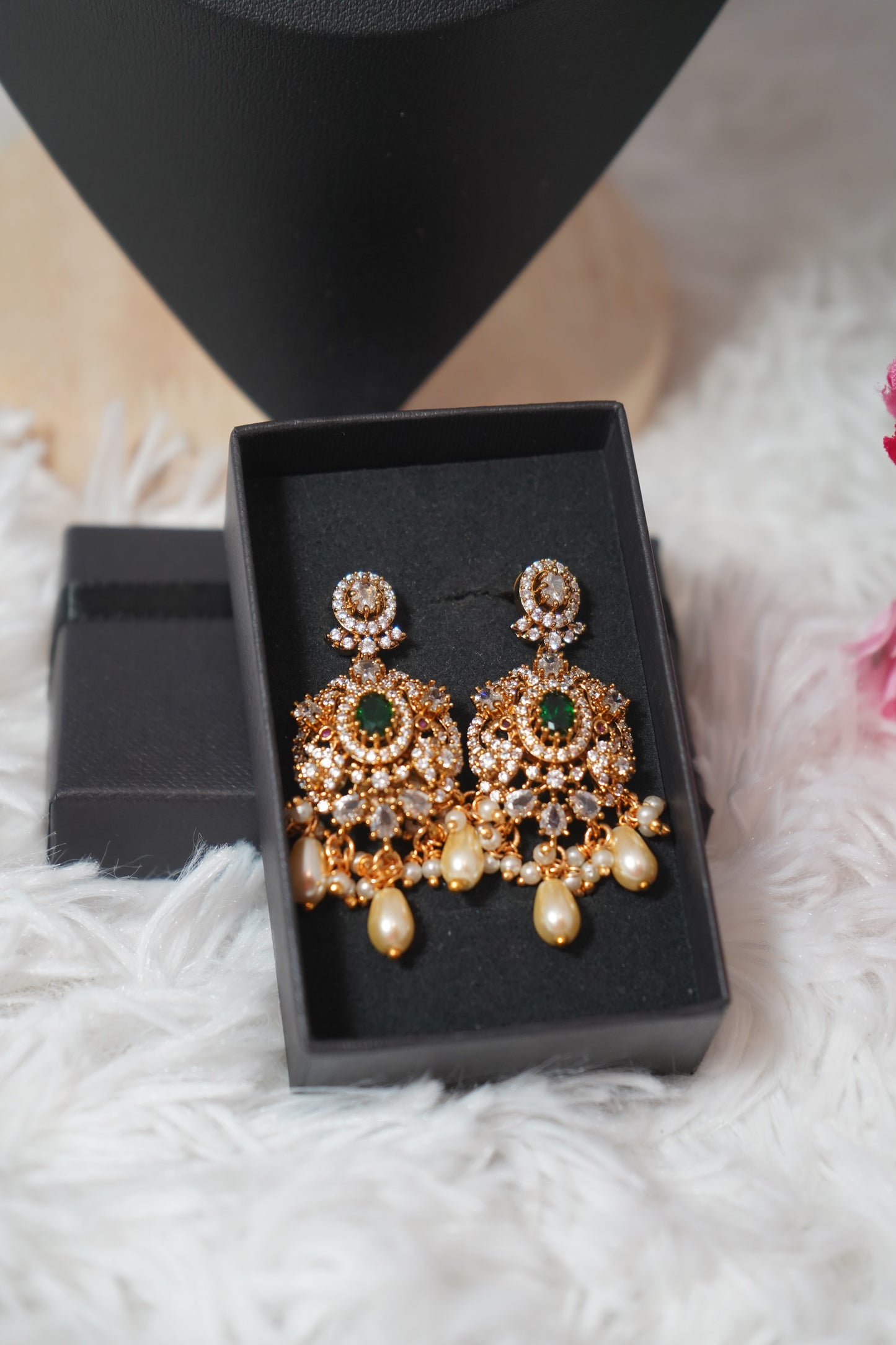 Necklace featuring green beads with elegant peacock detailing