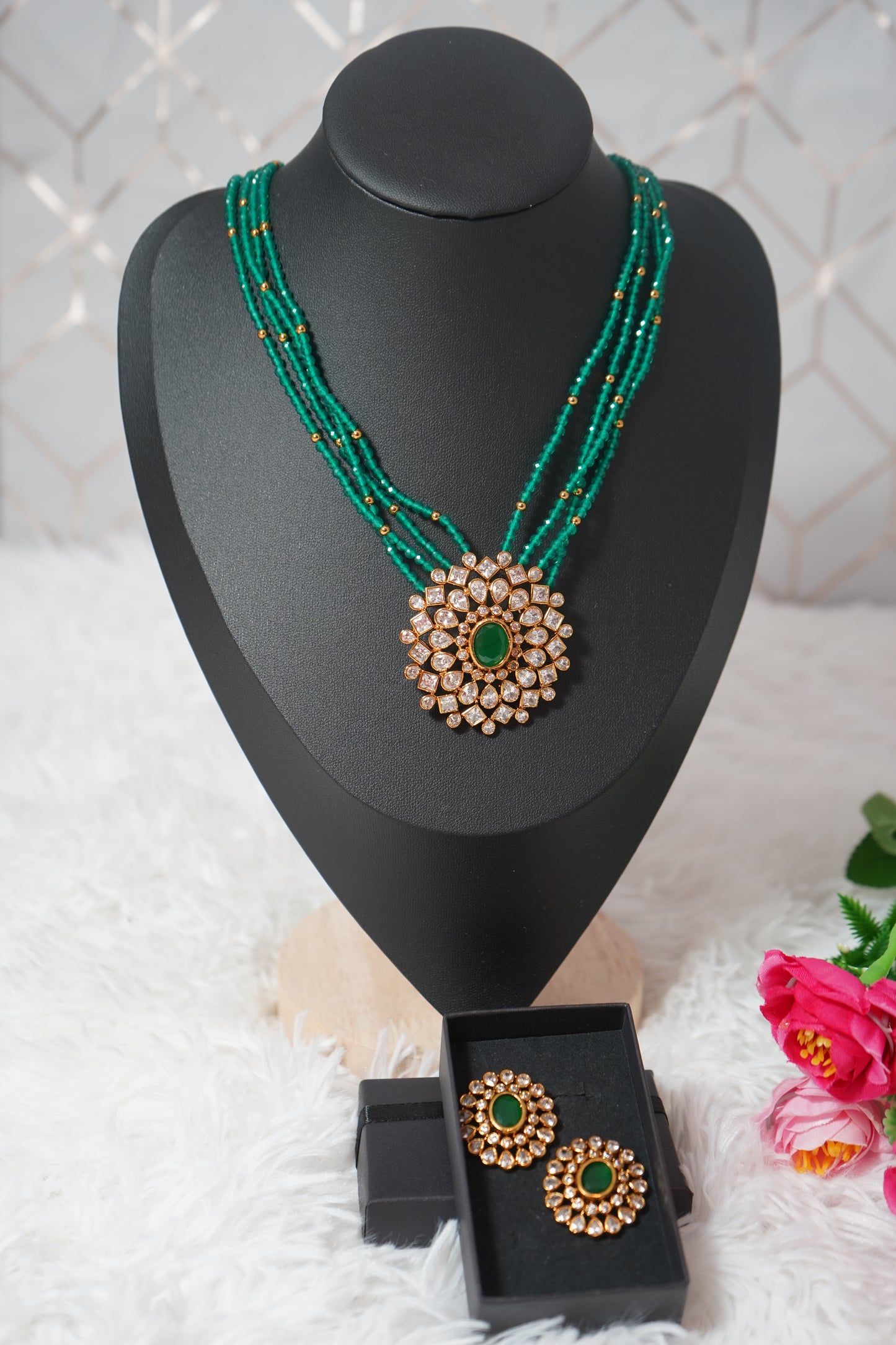 Necklace featuring green beads and studded Kundan work