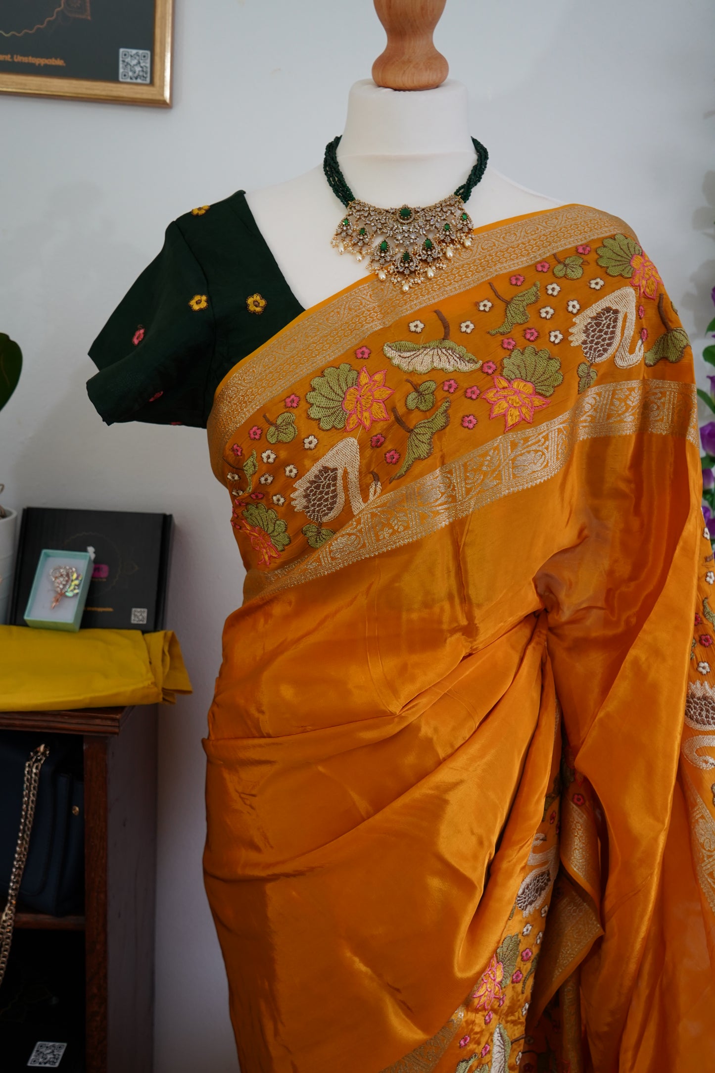 Mysore crepe silk saree with green stitched embroidered blouse - Orange, & floral zari motifs