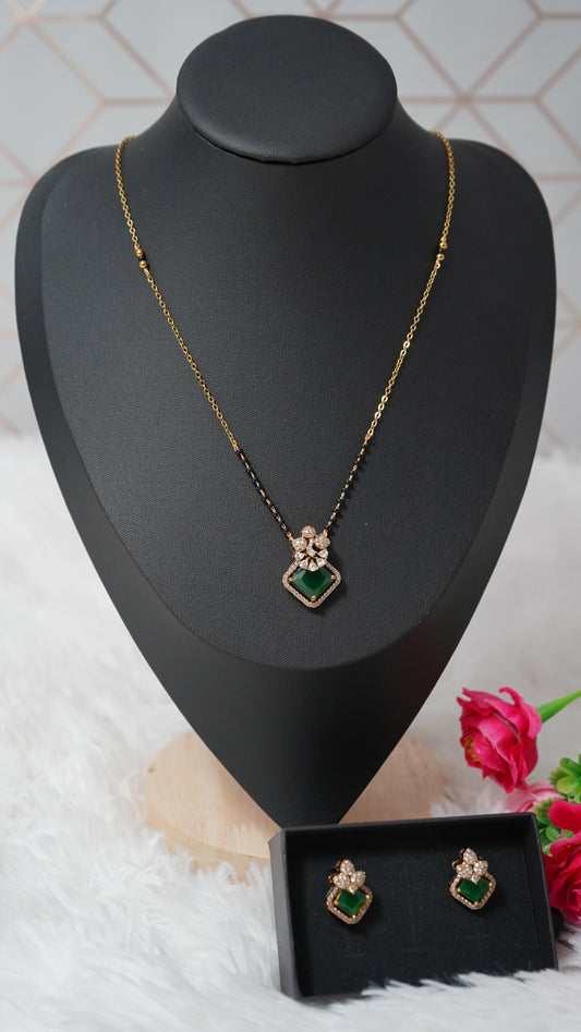 Beautiful short mangalsutra chain featuring black beads and green accents with Ear tops
