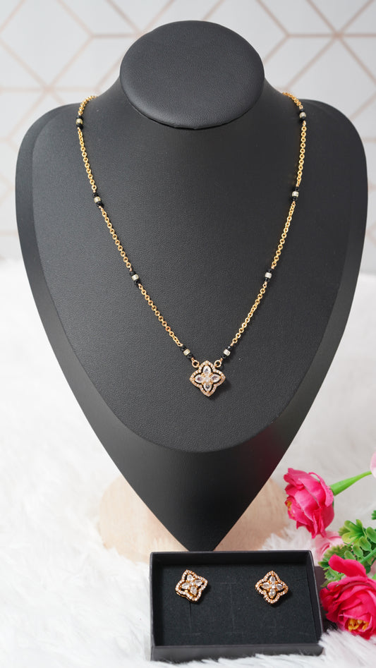 Short mangalsutra style chain set in micro gold plating, black beads with Ear tops