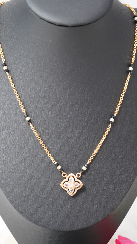 Short mangalsutra style chain set in micro gold plating, black beads with Ear tops