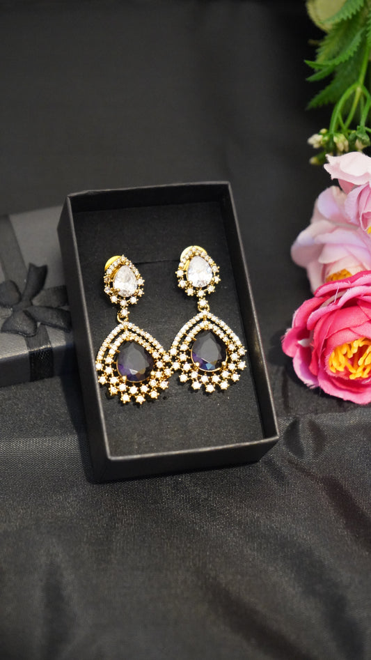 Diamond finish earrings with dark purple stone