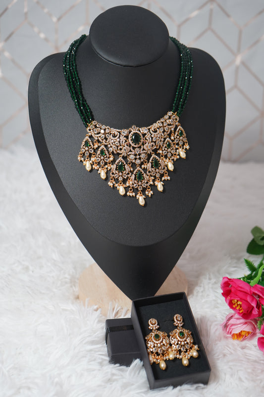 Necklace featuring green beads with elegant peacock detailing