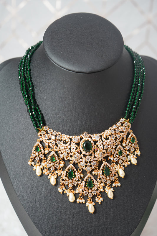 Necklace featuring green beads with elegant peacock detailing